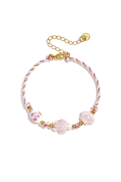 Bracelet with tortoise and shell beads and rope motif
